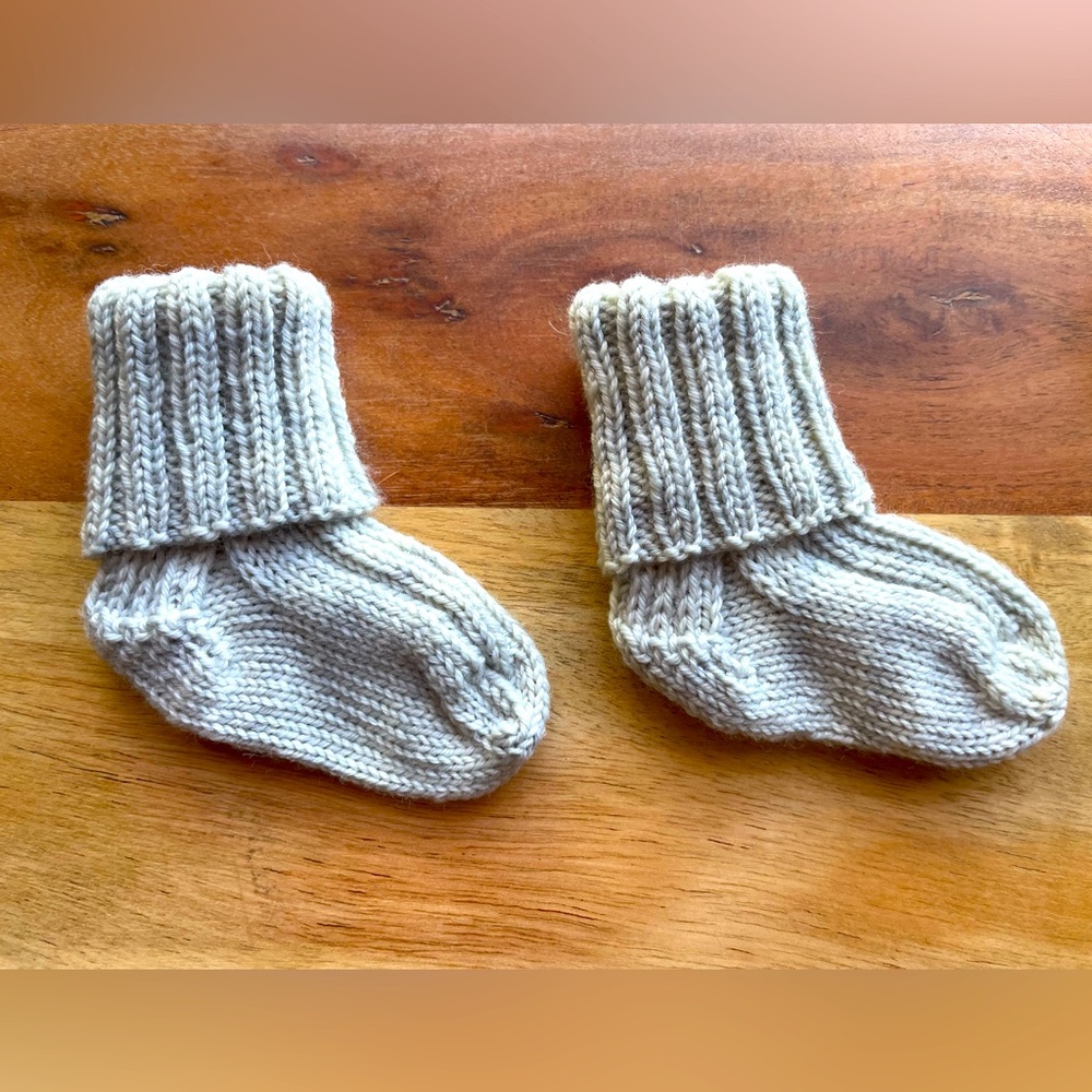 SOLD! Hand knit Baby Socks—that will actually stay on your baby’s feet!
